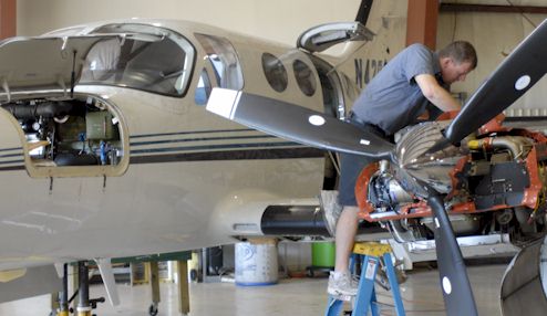 Team works on aircraft maintenance